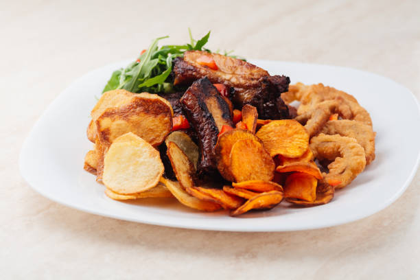 istock Grilled pork ribs with potato chips 1097808020