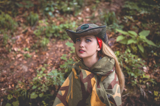 istock Camouflage woman in the forest 1097810246