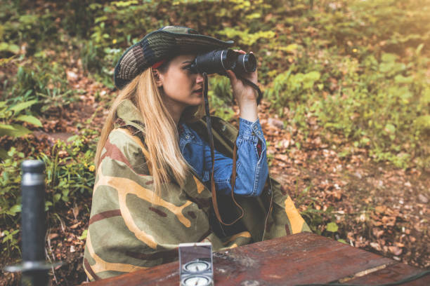 istock Camouflage woman in the forest 1097810284
