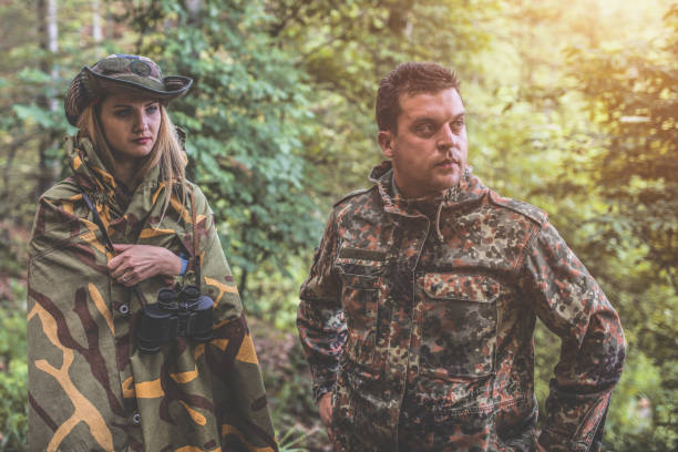 istock Camouflage patrol in the forest 1097810586