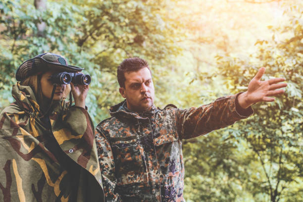 istock Camouflage patrol in the forest 1097810610