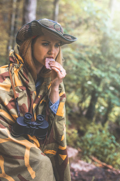 istock Camouflage woman in the forest 1097810772