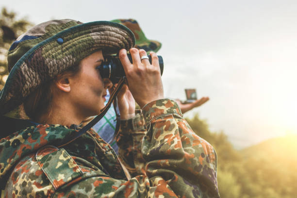 istock Camouflage woman in the forest 1097811776
