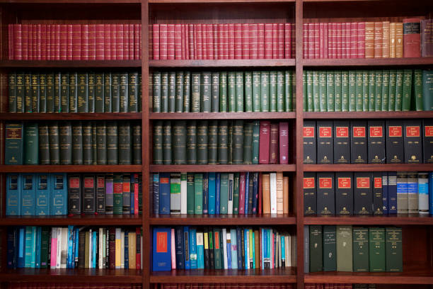 Bookshelf of Irish Legal Books A bookshelf containing volumes of books about Irish Law. courtroom stock pictures, royalty-free photos & images