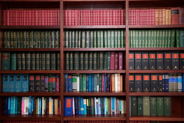 Bookshelf of Irish Legal Books A bookshelf containing volumes of books about Irish Law. book display stock pictures, royalty-free photos & images
