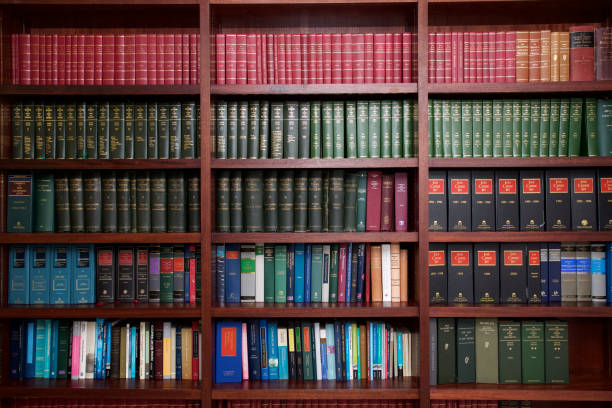 Bookshelf of Irish Legal Books A bookshelf containing volumes of books about Irish Law. court room stock pictures, royalty-free photos & images