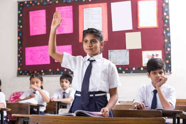 istock Schoolkids in classroom - Stock image 1097813078