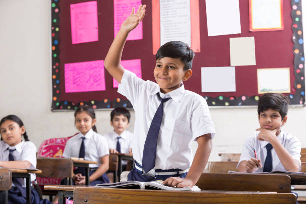 istock Schoolkids in classroom - Stock image 1097817548