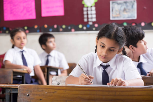 istock Schoolkids in classroom - Stock image 1097820166