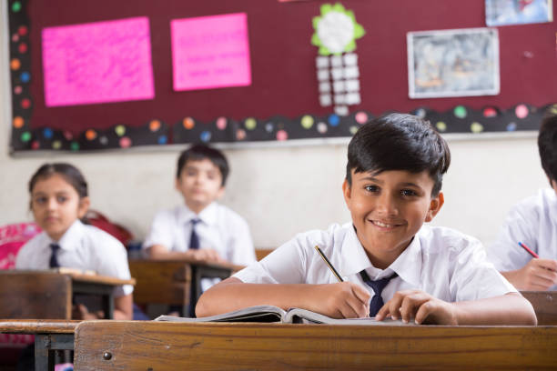 istock Schoolkids in classroom - Stock image 1097820824