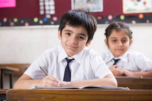istock Schoolkids in classroom - Stock image 1097821086