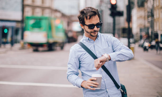 istock Busy man checking the time on wristwatch 1097821098