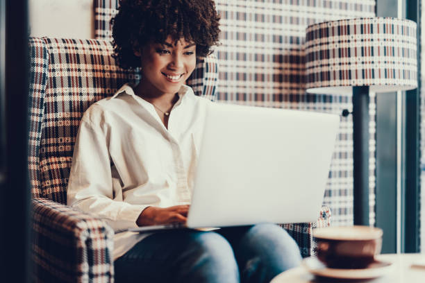 istock Beautiful lady looking at laptop and smiling 1097823256