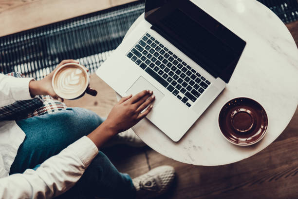 istock Calm woman sitting in cafe and using laptop 1097823308