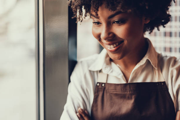 istock Cheerful waitress woman looking aside and smiling 1097823394