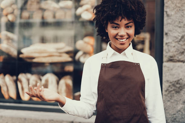 istock Happy lady holding palm hand up and smiling 1097823430
