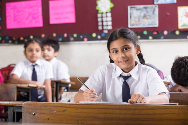 istock Schoolkids in classroom - Stock image 1097823616