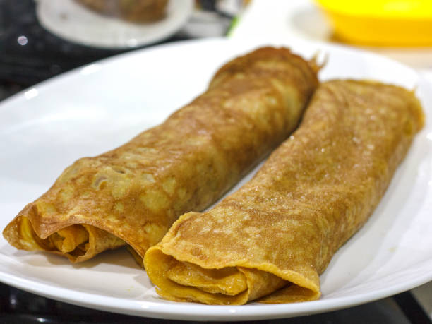 istock Japanese omelette, roll of fried eggs on white plate 1097823706