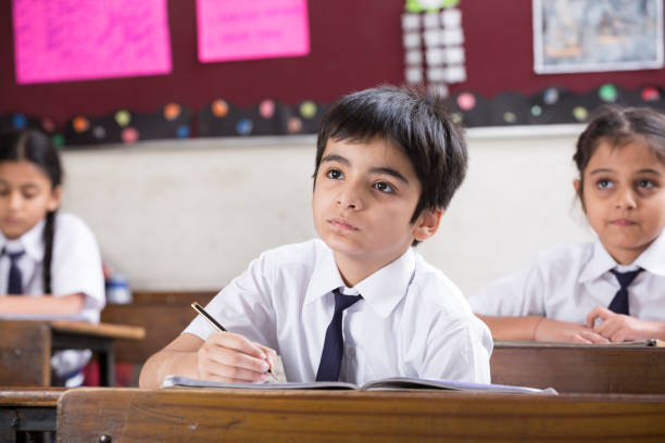 istock Schoolkids in classroom - Stock image 1097824502