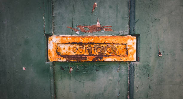 istock old rusty Portuguese mailbox on a worn wooden door 1097824760