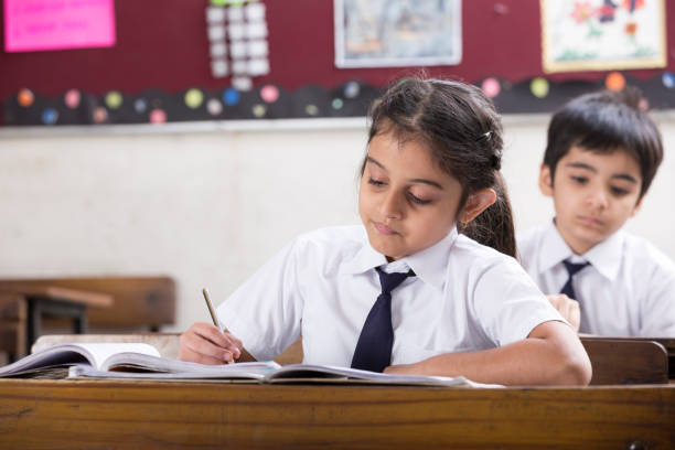 istock Schoolkids in classroom - Stock image 1097825902