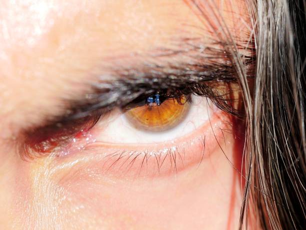 istock Male human eye amber color 1097826752