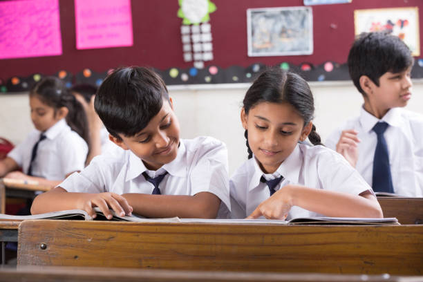 istock Schoolkids in classroom - Stock image 1097828568