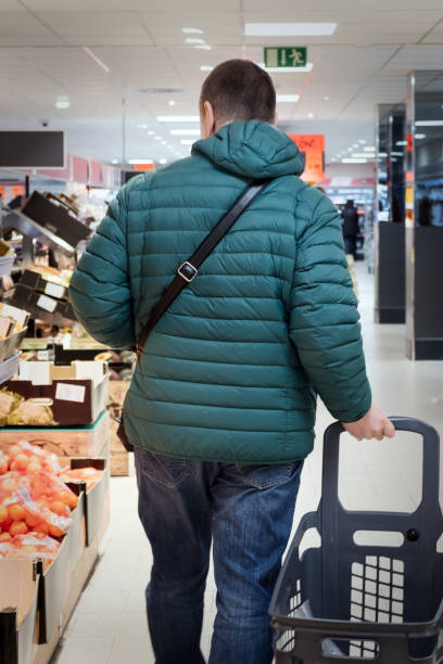 istock Mature man shopping in supermarket 1097828768