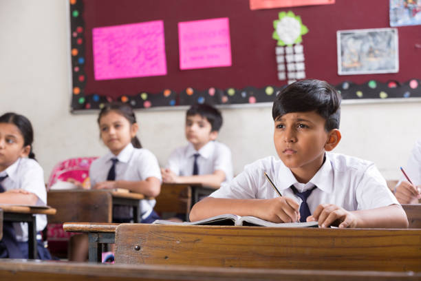 istock Schoolkids in classroom - Stock image 1097830760