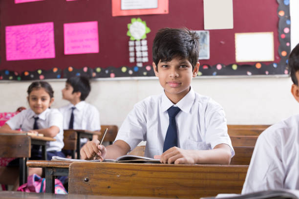 istock Schoolkids in classroom - Stock image 1097831228