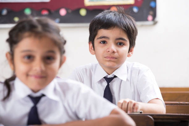 istock Schoolkids in classroom - Stock image 1097831662
