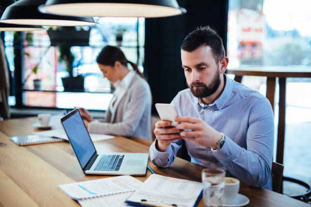 istock Businessman using mobile phone in the office 1097833598