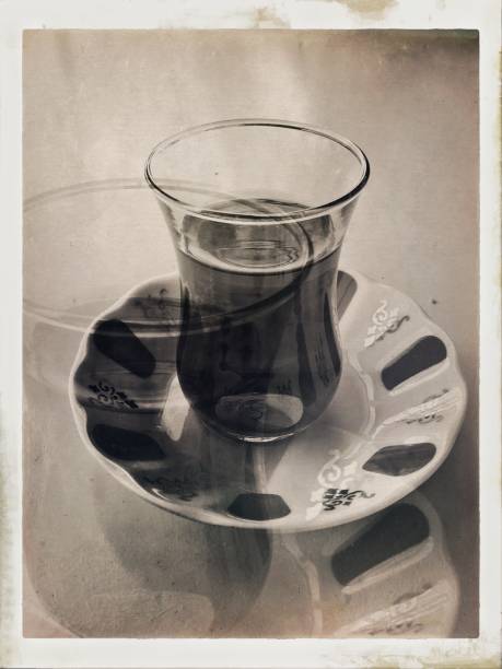 istock Multiple exposure sepia toned tea glass and plate 1097836430