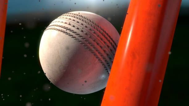 Cricket Bat Hitting Stumps An extreme closeup of a white leather stitched cricket ball hitting orange wickets with dirt particles emanating from the impact at night - 3D render wicket stock pictures, royalty-free photos & images