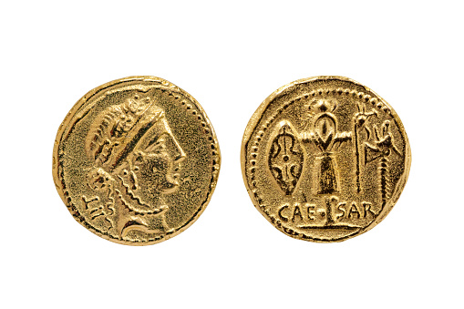 Roman Aureus Gold Coin replica of Julius Caesar with a probable portrait of the goddess Venus and a Trophy of Gallic Arms on the reverse struck between 48-47 BC cut out and isolated on a white background