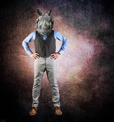 Humanoid rhinoceros - rhinoceros head on man in a suit - Image manipulation