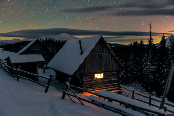 istock cozy light in wooden cabin in winter 1097854954