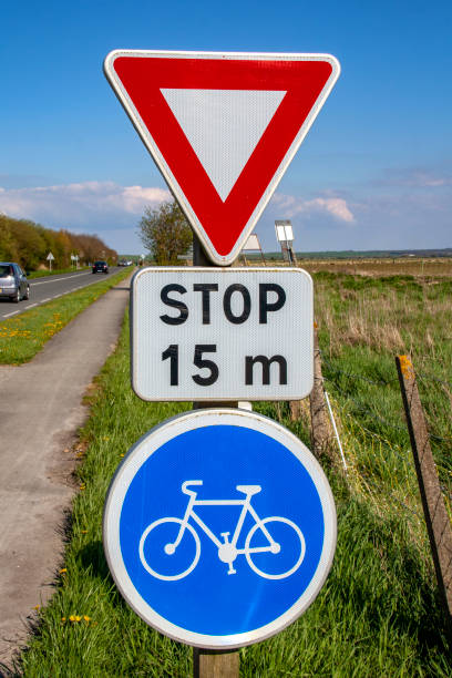 istock Bike path and stop signs 1097860782