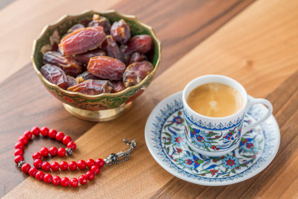 istock Turkish coffee, dates, and red prayer beads on table side view 1097865172