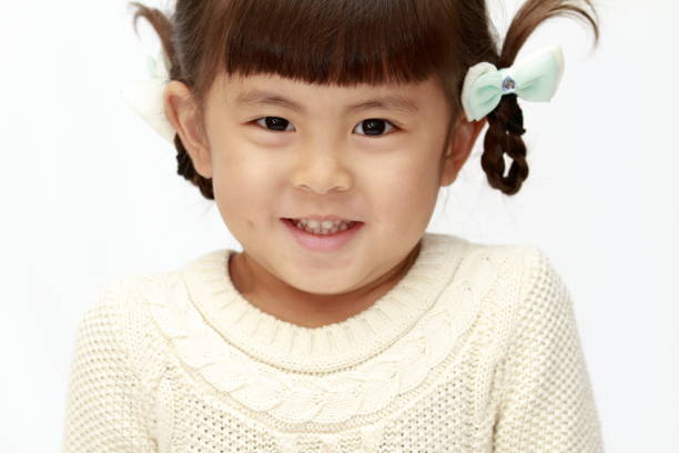 istock smiling Japanese girl (4 years old) (white back) 1097866800