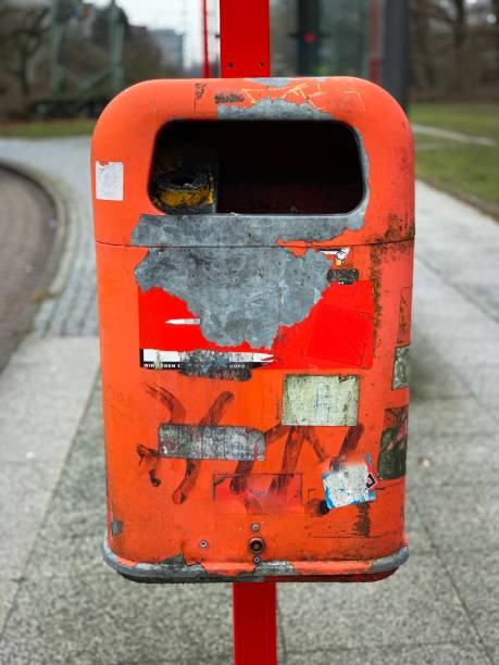 istock Red metal dirty trashcan 1097874672