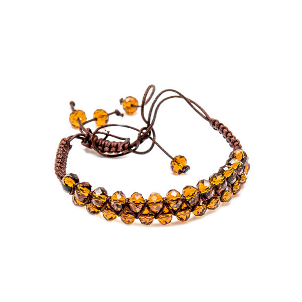istock Bracelet with orange beads isolated on white background 1097880818
