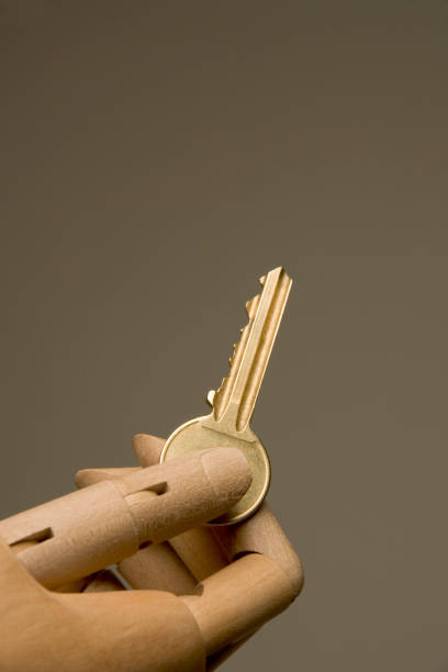 istock An artists mannequin hand presenting a house door key 1097880946