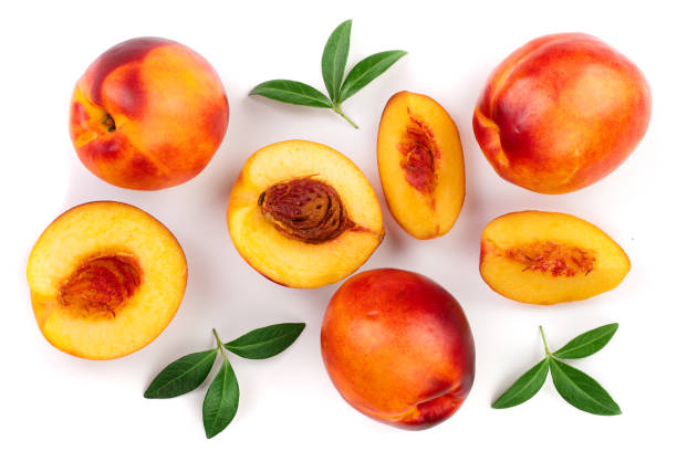 istock ripe nectarine with leaves isolated on white background. Top view. Flat lay pattern 1097885820