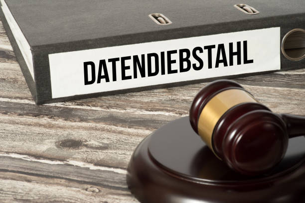 istock A judge's hammer and folder with the imprint data theft 1097887186