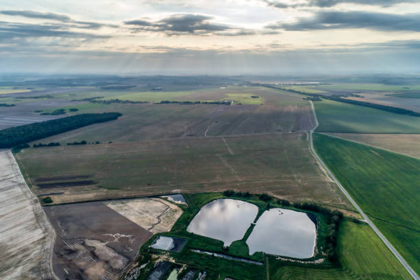 istock Rural flat landscape. Plowed and sown fields. Evening shooting. 1097890498