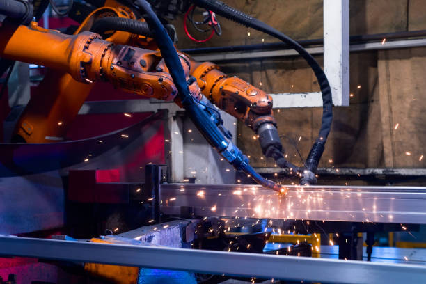 istock Welding robot, the process of welding a metal profile. 1097890534