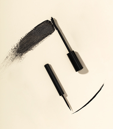 Mascara brush stroke and liquid eyeliner isolated on background (with clipping path)