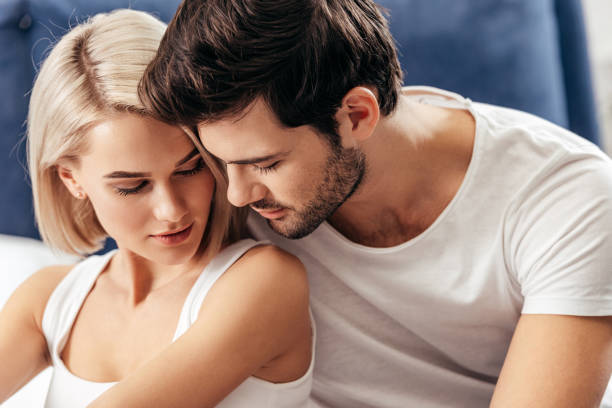 istock attractive girlfriend and handsome boyfriend at home 1097894392