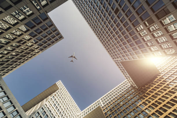 istock Plane Flying Over the Skyscrapers 1097894562